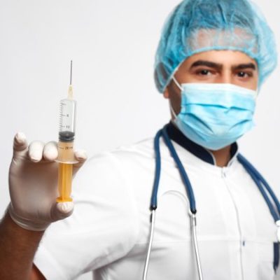 selective-focus-syringe-professional-male-surgeon-is-holding-posing-grey-wall-medicine-profession-occupation-injector-medical-survey-preventive-health-living-concept-Copia-450x450